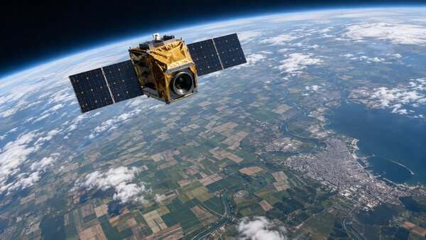 Concept satellite above fields and coastlines